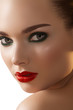 Photo: Woman with dark green smoky-eyes make-up, red lips Woman with dark green smoky-eyes make-up, red lips
