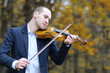 young man playing at musical instrument