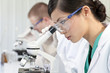 Chinese Female Woman Scientist & Microscope In Laboratory