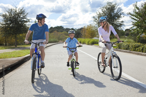 Photo: Young Family Parents and Boy Son Cycling Young Family Parents and Boy Son Cycling