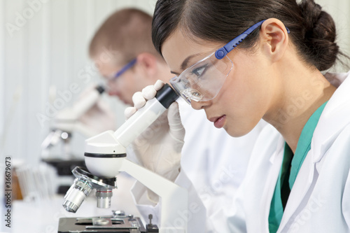 Photo: Chinese Female Woman Scientist & Microscope In Laboratory Chinese Female Woman Scientist & Microscope In Laboratory