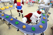 santa claus at christmas ornament production line in factory santa claus at christmas ornament production line in factory