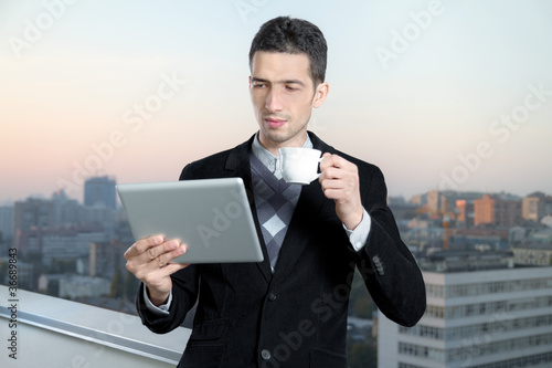 Foto: Businessman On Coffee Break Businessman On Coffee Break