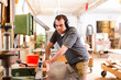 Foto: Carpenter with electric cutter Carpenter with electric cutter