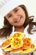 Adorable Girl Child in Chef Uniform with Iced Thanks Giving Day
