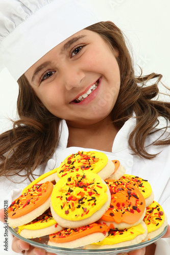 Photo: Adorable Girl Child in Chef Uniform with Iced Thanks Giving Day Adorable Girl Child in Chef Uniform with Iced Thanks Giving Day