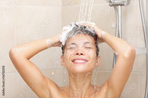 Photo: Woman in shower washing hair Woman in shower washing hair