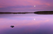 Moon rising over swedish lake Moon rising over swedish lake