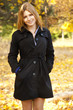 Smiling happy girl in autumn park