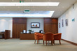 armchairs, table and reception in light, clean and empty office armchairs, table and reception in light, clean and empty office