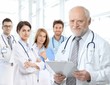 Portrait of aged doctor with medical residents