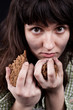 poor beggar woman with a piece of bread