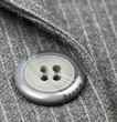 Button on a gray suit Button on a gray suit