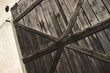 Old wooden door with big cross