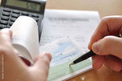 Photo: Prepare writing a check Prepare writing a check