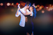 Photo: Loving couple dancing in the night city Loving couple dancing in the night city