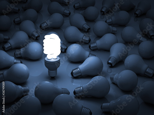 Photo: One glowing eco compact fluorescent light bulb One glowing eco compact fluorescent light bulb