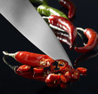 Foto: chillies and kitchen knife chillies and kitchen knife