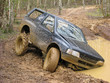 Foto: Big 4x4 off roader stuck in mud Big 4x4 off roader stuck in mud