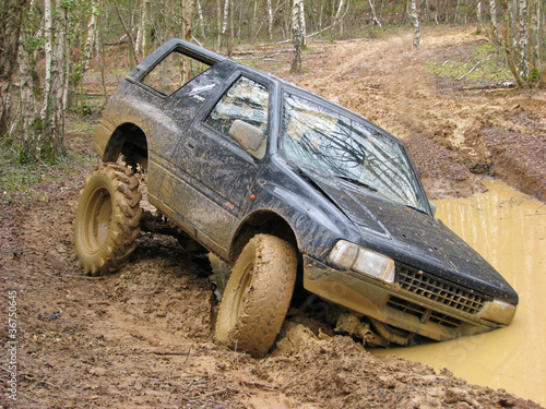 Photo: Big 4x4 off roader stuck in mud Big 4x4 off roader stuck in mud