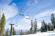 Chair lifts against the blue sky