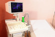 Photo: Patientenliege mit Ultraschallgerät Patientenliege mit Ultraschallgerät