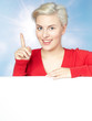 Young woman presenting copyspace in front of blue sky