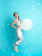 happy, young woman with balloons, smiling