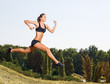 Young woman running outdoors
