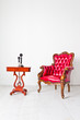 vintage luxury armchair and telephone in white room