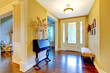 Photo: Luxury home entrance and hallway in golden yellow. Luxury home entrance and hallway in golden yellow.