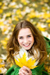 Woman holding autumn leaf