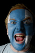 Face of crazy angry man painted in colors of finland flag Face of crazy angry man painted in colors of finland flag