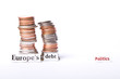 stack of coins with Europe's debt and politics in text