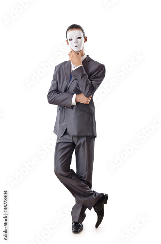 Photo: Industrial espionage concept with masked businessman Industrial espionage concept with masked businessman