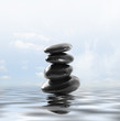 zen stones on the water