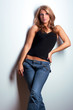 Young attractive model standing near wall Young attractive model standing near wall
