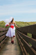 Photo: Beautiful Bride Walking Over Bridge Beautiful Bride Walking Over Bridge