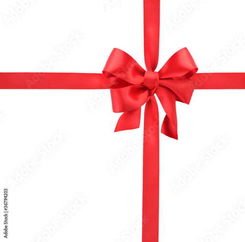 Photo: Red satin gift bow. Ribbon. Isolated on white Red satin gift bow. Ribbon. Isolated on white
