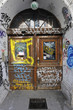Scribbling on a wooden door in an archway in Berlin Scribbling on a wooden door in an archway in Berlin
