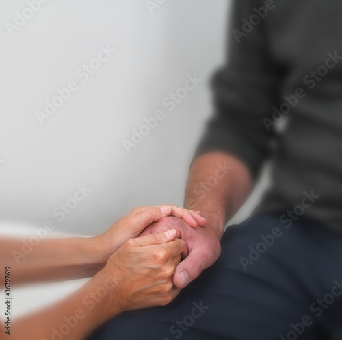 Photo: Offering comfort to a patient Offering comfort to a patient