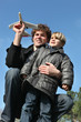 father playing with his son in the park