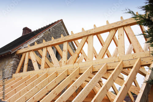 Photo: construction of the wooden frame of a roof, charpente construction of the wooden frame of a roof, charpente