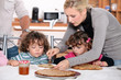 Parents preparing breakfast for children