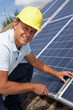 Photo: Man installing solar panels Man installing solar panels