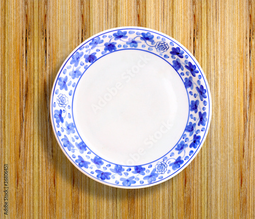 Photo: Painted plate on wood Painted plate on wood