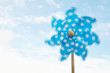 Child's plastic windmill turning in wind