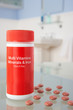 Vitamin pills on bathroom shelf