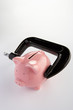 Piggybank in a vice