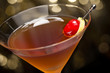 Manhattan cocktail garnished with a cherry and lemon Manhattan cocktail garnished with a cherry and lemon